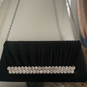 Black clutch purse/ wristlet with diamonds. Easy accessible. Pm for more info